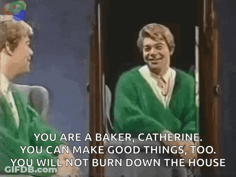 A Man In A Green Sweater Is Talking To Another Man In A Green Sweater . GIF