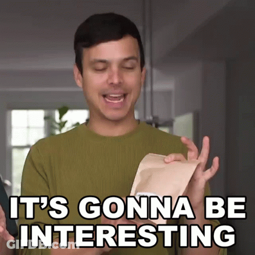 A Man In A Green Sweater Says It 'S Gonna Be Interesting While Holding A Piece Of Paper GIF