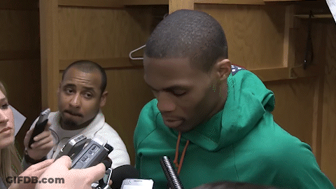 Man In Green Sweatshirt Being Interviewed GIF