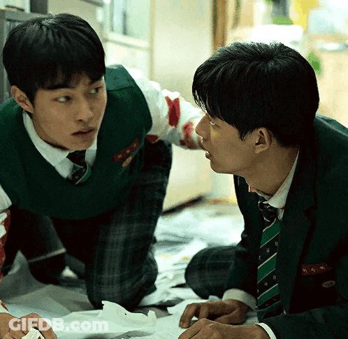 A Man In A Green Vest And Tie Has The Letter K On His Pocket GIF