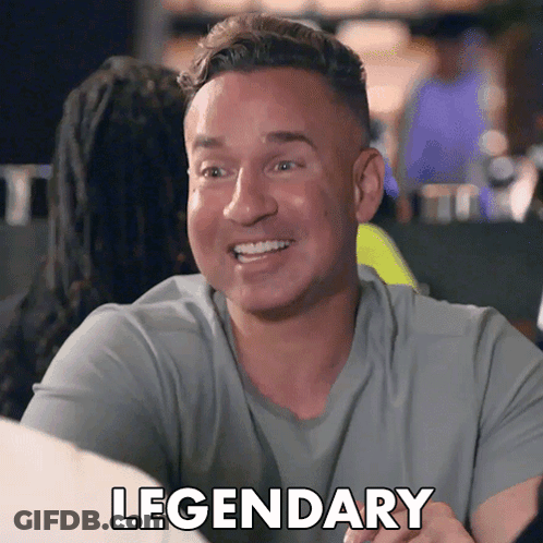 A Man In A Grey Shirt Is Smiling And The Word Legendary Is On The Bottom GIF