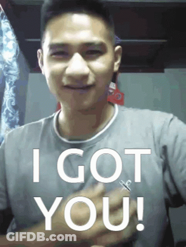A Man In A Grey Shirt Says " I Got You " In White Letters GIF