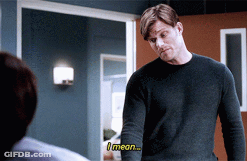 Man In Grey Sweater Saying I Mean To Another Man GIF