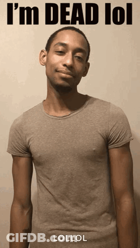 A Man In A Grey T-Shirt With The Words I 'M Dead Lol On It GIF