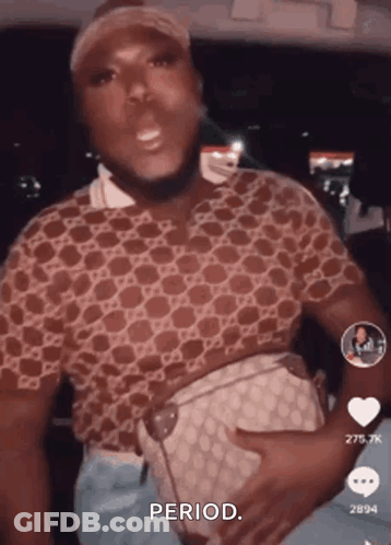 A Man In A Gucci Shirt Is Holding A Purse And Says " Period " GIF