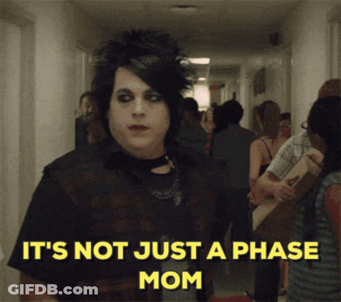 A Man In A Hallway With The Words It 'S Not Just A Phase Mom Below Him GIF