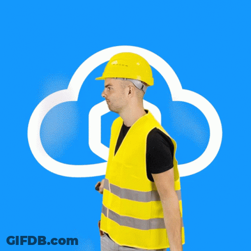 A Man In A Hard Hat Is Holding A Laptop In Front Of A Cloud GIF