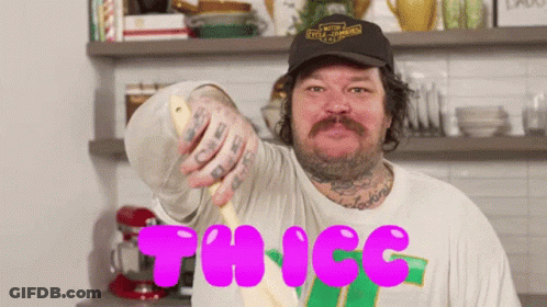 A Man In A Harley Davidson Hat Is Holding A Spoon In His Hand GIF
