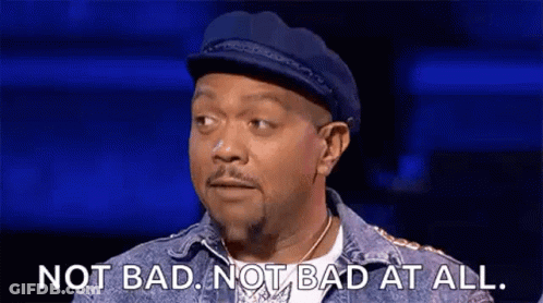 A Man In A Hat And Denim Jacket Is Saying `` Not Bad , Not Bad At All '' . GIF