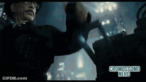 A Man In A Hat And Glasses Is Holding A Gun And The Words Cromosomo Nerd Are On The Bottom Of The Screen GIF