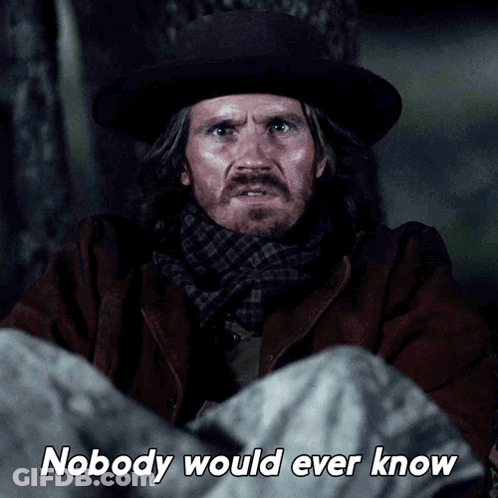 A Man In A Hat And Scarf Is Laying Down With The Words Nobody Would Ever Know Below Him GIF