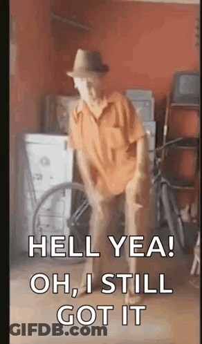 A Man In A Hat Is Dancing In A Garage With The Words `` Hell Yea Oh , I Still Got It '' . GIF