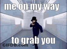A Man In A Hat Is Dancing In A Hallway With The Words Me On My Way To Grab You . GIF