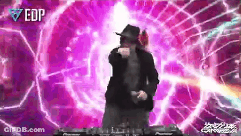 A Man In A Hat Is Dancing In Front Of A Purple Background With Edp Written On It GIF