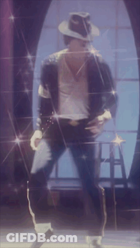 A Man In A Hat Is Dancing On A Stage In Front Of A Window GIF