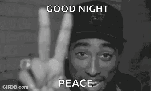 A Man In A Hat Is Giving A Peace Sign In A Black And White Photo . GIF