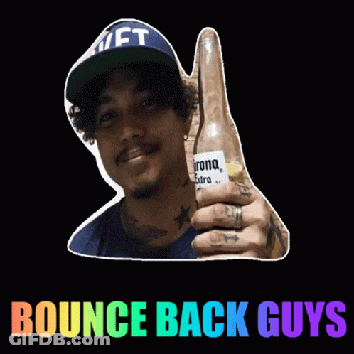 A Man In A Hat Is Holding A Corona Beer GIF
