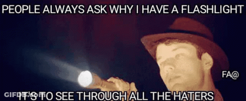 A Man In A Hat Is Holding A Flashlight And Says People Always Ask Why I Have A Flashlight . GIF
