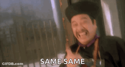 A Man In A Hat Is Holding A Gun And Says Same Same . GIF