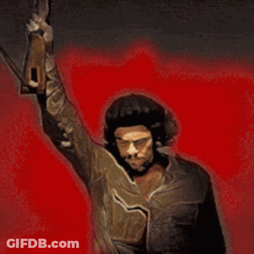A Man In A Hat Is Holding A Gun Up In The Air GIF