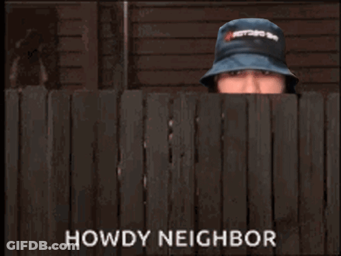 A Man In A Hat Is Peeking Over A Wooden Fence And The Words Howdy Neighbor Are Above Him GIF