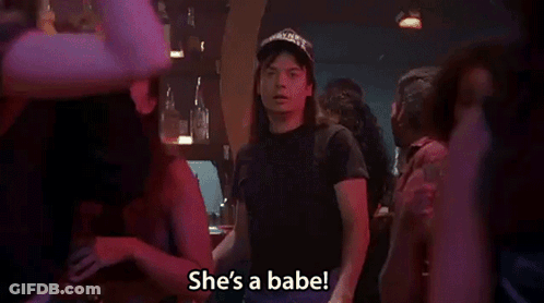 A Man In A Hat Is Standing In A Crowd And Says She 'S A Babe . GIF