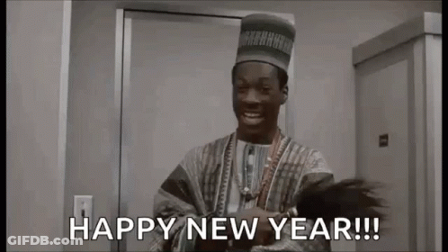 A Man In A Hat Is Standing In Front Of A Door And Saying `` Happy New Year ! '' GIF