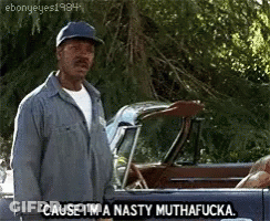A Man In A Hat Is Standing Next To A Car And Saying Cause I 'M A Nasty Muthafucka GIF