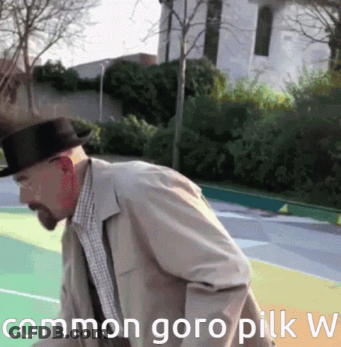 A Man In A Hat Is Standing On A Basketball Court With The Words Common Goro Pilk W Written Below Him GIF