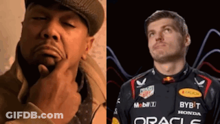 A Man In A Hat Is Thinking Next To A Man In A Red Bull Racing Uniform GIF