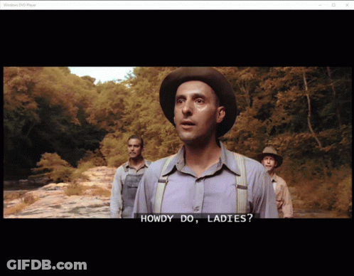 A Man In A Hat Says Howdy Do Ladies In Front Of Two Other Men GIF