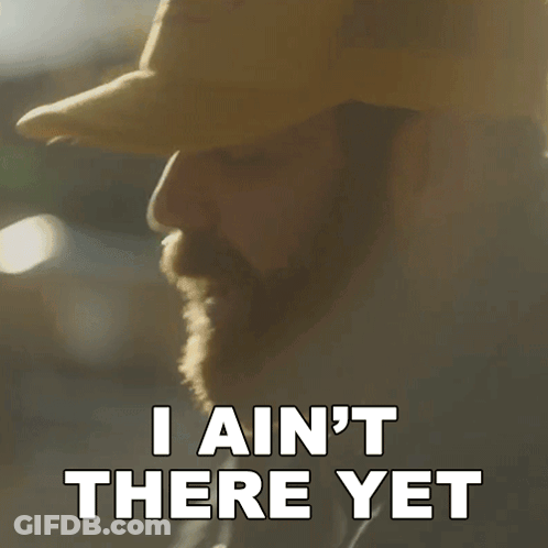 A Man In A Hat Says I Ain T There Yet GIF