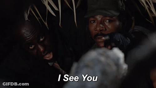 A Man In A Hat Says " I See You " To Another Man GIF