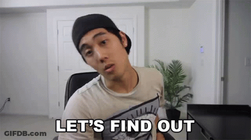 A Man In A Hat Says Let 'S Find Out In Front Of A Plant GIF
