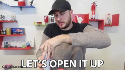 A Man In A Hat Says Let 'S Open It Up While Holding Something GIF