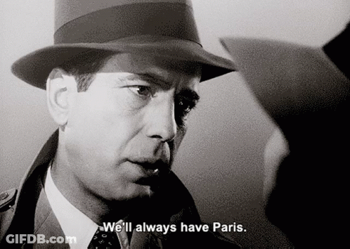 A Man In A Hat Says " We 'Ll Always Have Paris " In A Black And White Photo GIF