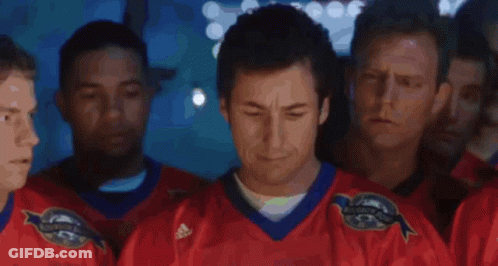 A Man In A Hat Stands In Front Of A Crowd And Says We Suck Again GIF