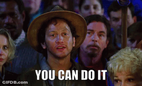 A Man In A Hat Stands In Front Of A Crowd With The Words You Can Do It Above Him GIF