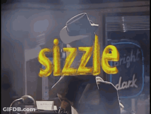 A Man In A Hat Stands In Front Of A Neon Sign That Says Sizzle GIF