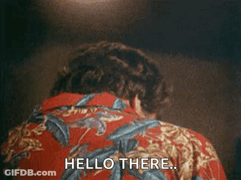 A Man In A Hawaiian Shirt Is Laying Down And Saying `` Hello There '' . GIF