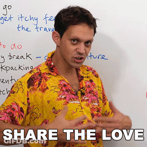 A Man In A Hawaiian Shirt Is Standing In Front Of A Whiteboard That Says Share The Love GIF
