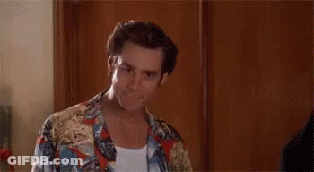 A Man In A Hawaiian Shirt Is Standing In Front Of A Wooden Wall And Saying `` Alright Then ! '' GIF