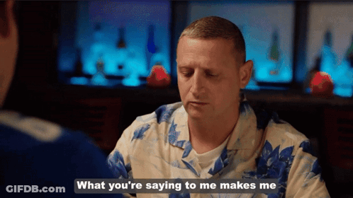 A Man In A Hawaiian Shirt Is Talking To Another Man And Says What You 'Re Saying To Me Makes Me GIF