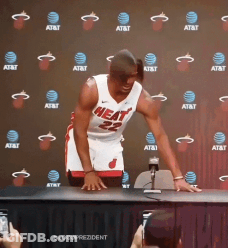 A Man In A Heat Jersey Stands In Front Of An At & T Backdrop GIF