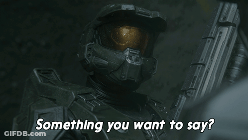 A Man In A Helmet Is Holding A Gun And Asking Something You Want To Say GIF