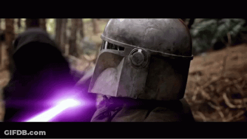 A Man In A Helmet Is Holding A Purple Lightsaber GIF