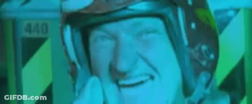 A Man In A Helmet Is Making A Funny Face And Says Hello GIF