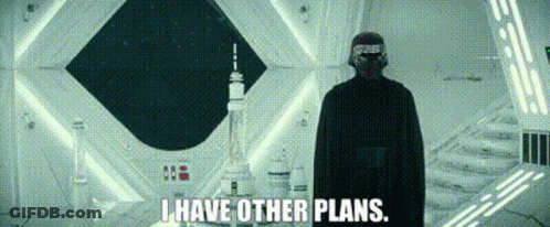 A Man In A Helmet Is Standing In A Room With The Words `` I Have Other Plans '' . GIF