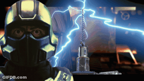 A Man In A Helmet Stands In Front Of A Lightning Strike GIF