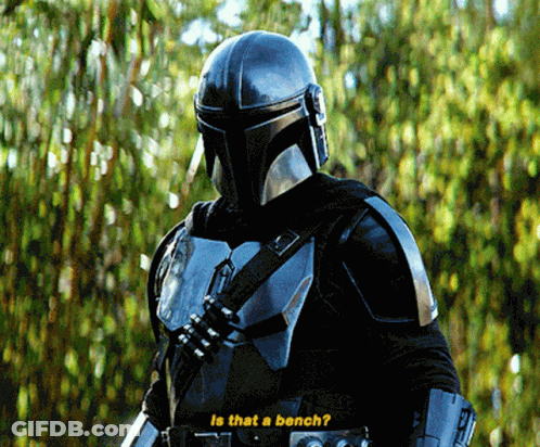 A Man In A Helmet Stands In Front Of Trees And Says Is That A Bench GIF
